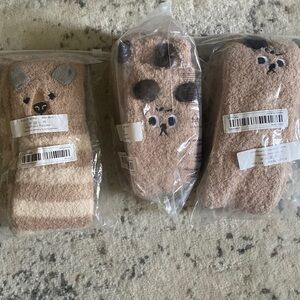 Brand fuzzy bear socks that can go up tho knee.